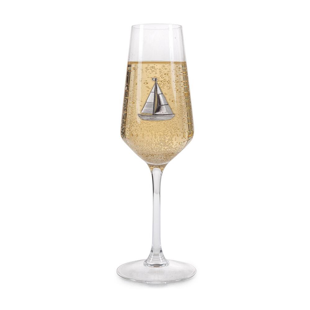 A Champagne Flute with a Pewter Sailing badge on the front, filled with Champagne