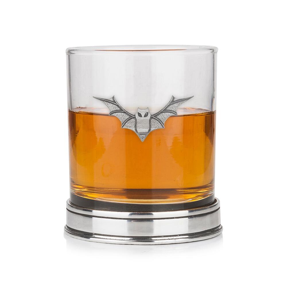 A Whisky Tumbler with a Pewter Bat badge on the front