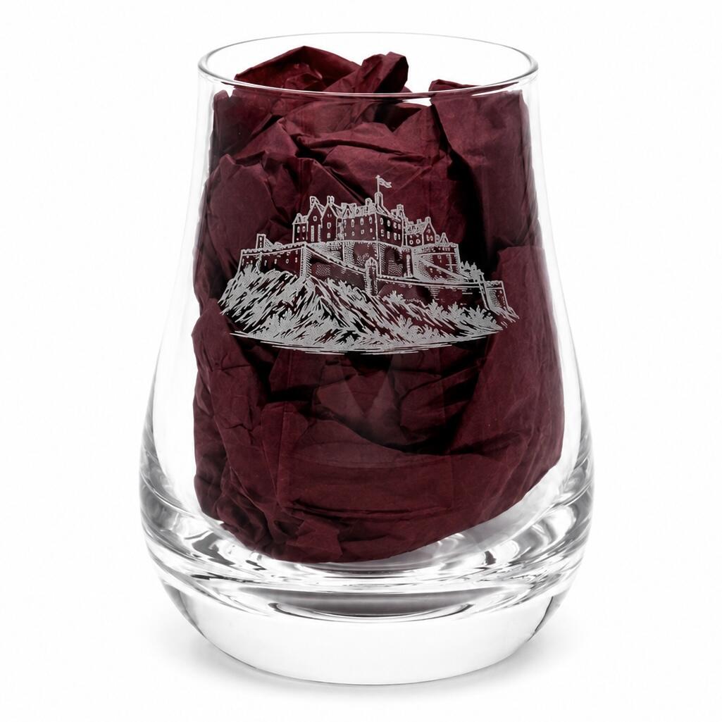 Close-up of Edinburgh Castle engraved whisky tasting glass with burgundy gift-box tissue