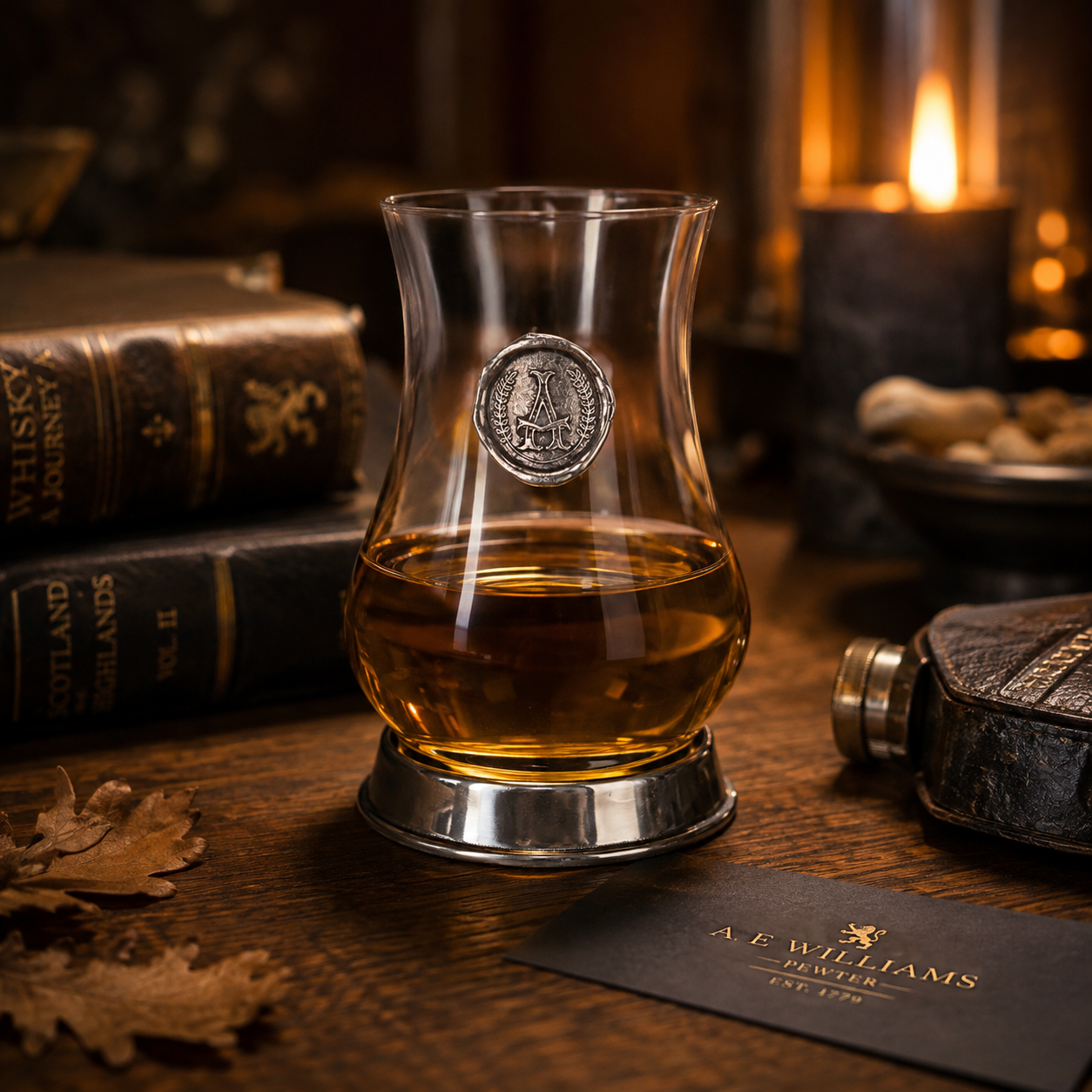 A Whisky Tasting Glass with a Pewter Monogram Seal on the front