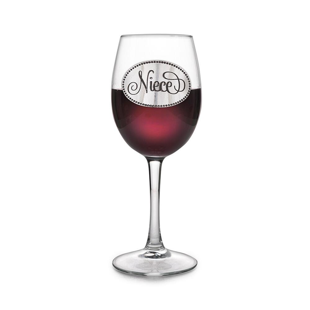 Wine glass with handmade pewter niece badge filled with red wine