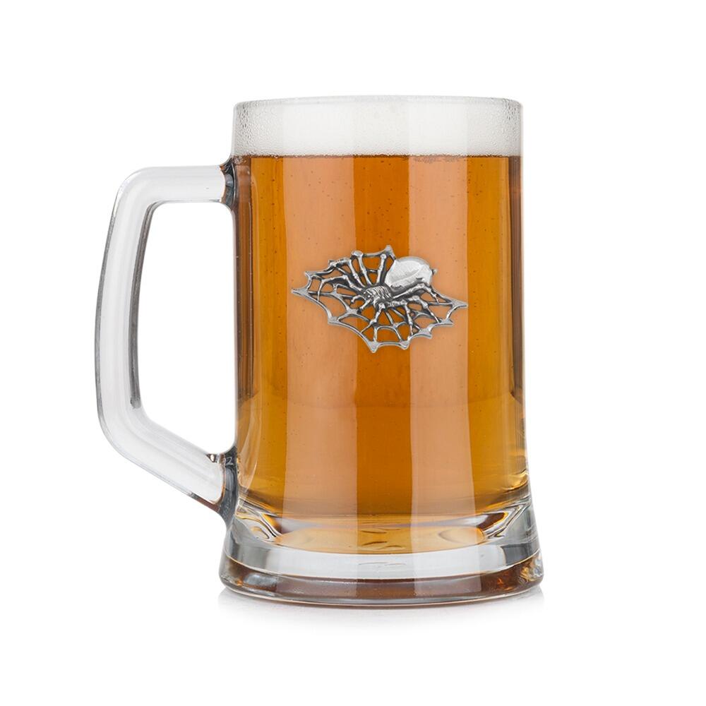 A Beer Tankard with a Pewter Spider badge on the front, filled with Amber Beer