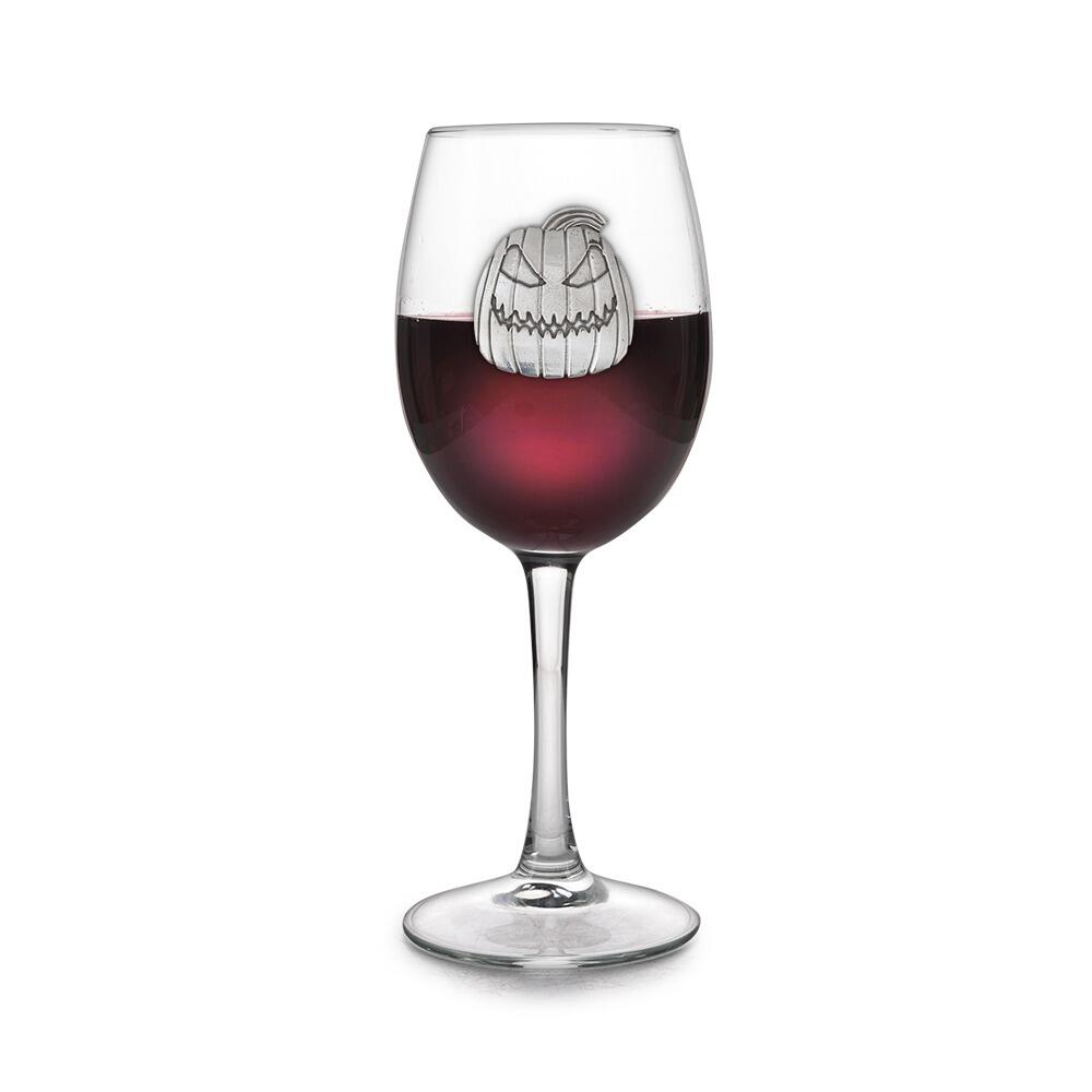 Wine glass with handmade pewter pumpkin badge filled with red wine