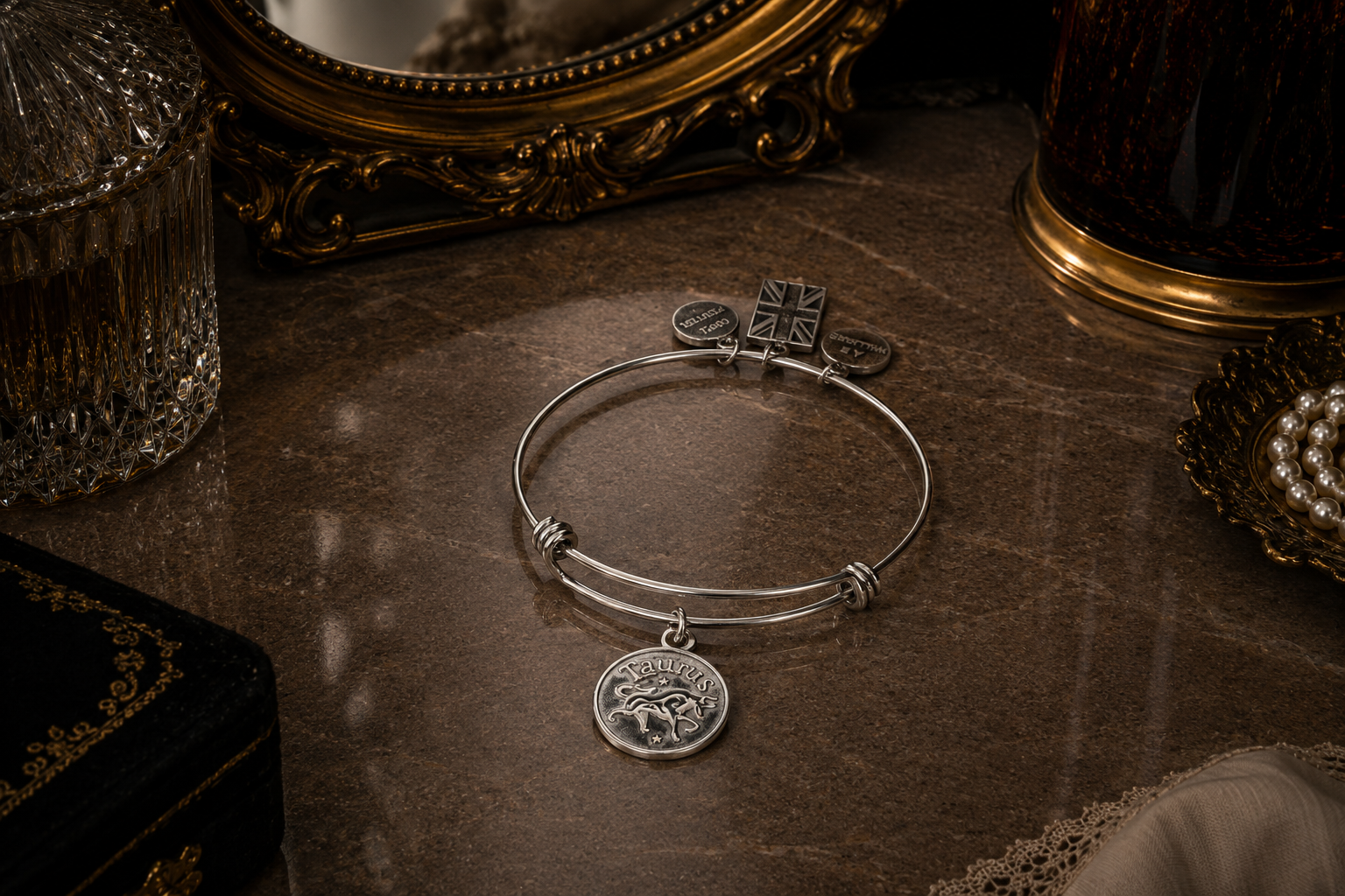A Pewter Taurus Charm on a bracelet and Vanity Stand