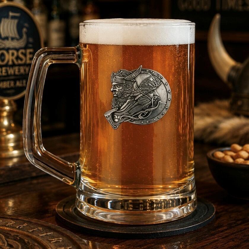 A Beer Tankard with a Pewter Viking badge on the front, filled with Amber Beer