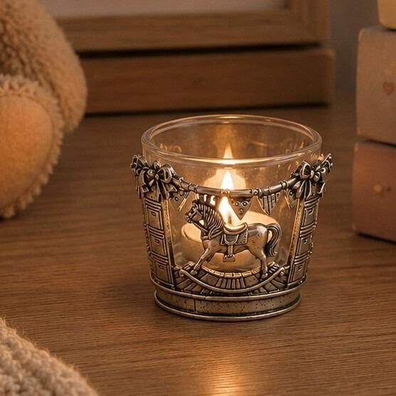 Pewter and glass tealight candle holder featuring an intricate rocking horse and nursery bunting design