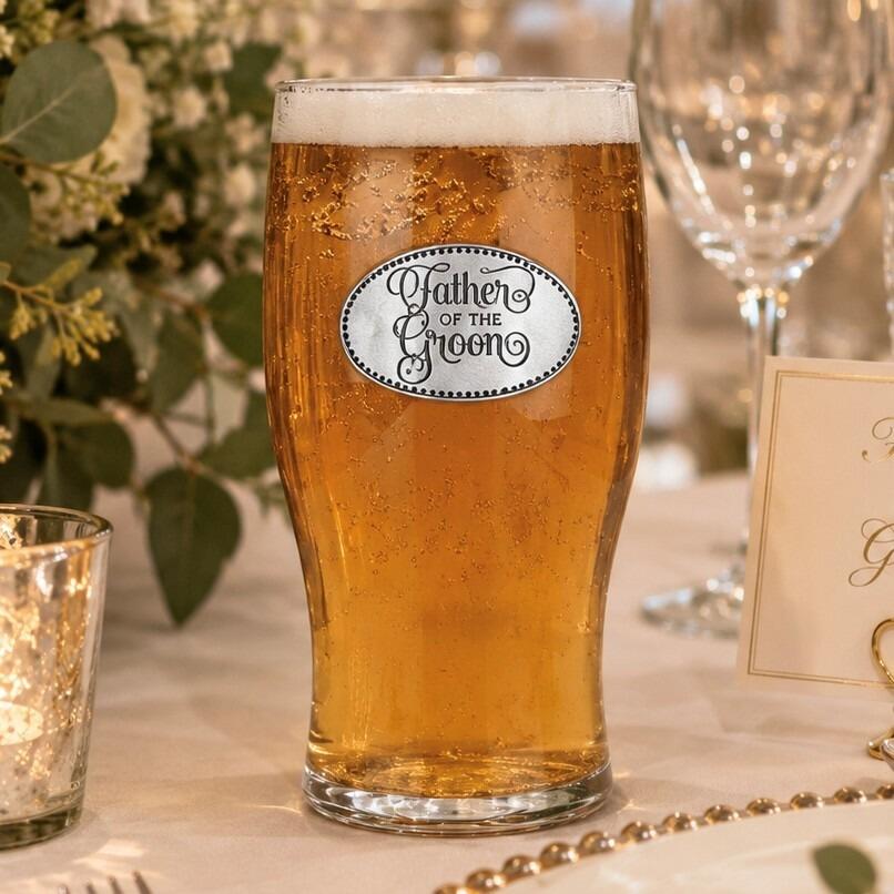Pint glass with handmade pewter father of the groom in formal attire badge filled with golden beer