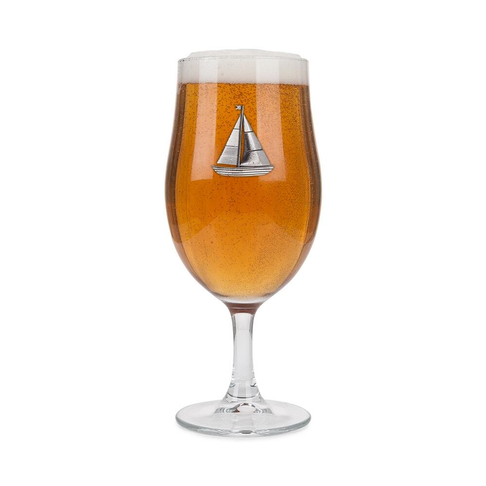 A Stemmed Pint Beer Glass with a Pewter Sailing badge on the front, filled with Beer