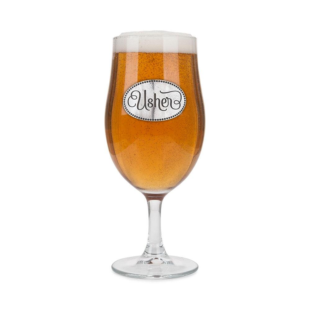 A Stemmed Pint Beer Glass with a Pewter Usher badge on the front, filled with Beer