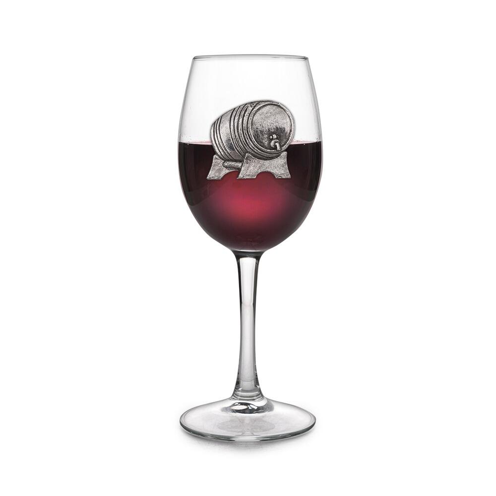 Wine glass with handmade pewter wine barrel badge filled with red wine