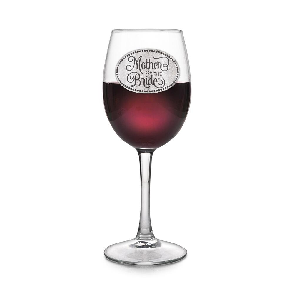 Wine glass with handmade pewter Mother Of The Bride badge filled with red wine