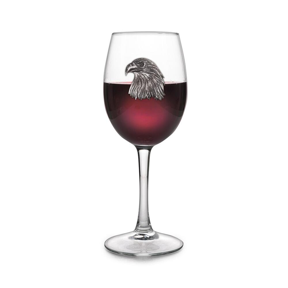 Wine glass with handcrafted pewter Eagle badge filled with red wine