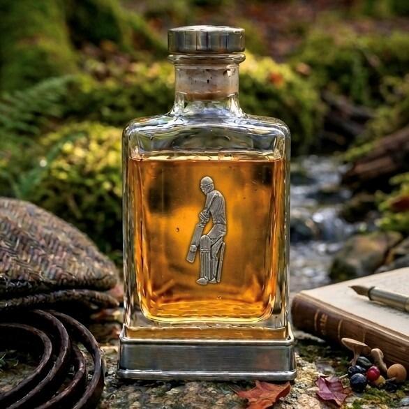 Handcrafted glass hip flask with pewter base featuring detailed cricketer emblem on front