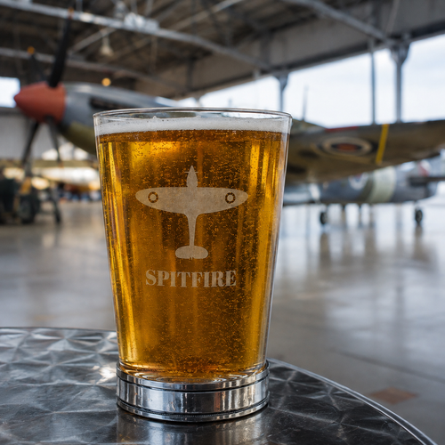 A Pint Glass with a Spitfire engraved on the front with a Polished Pewter base
