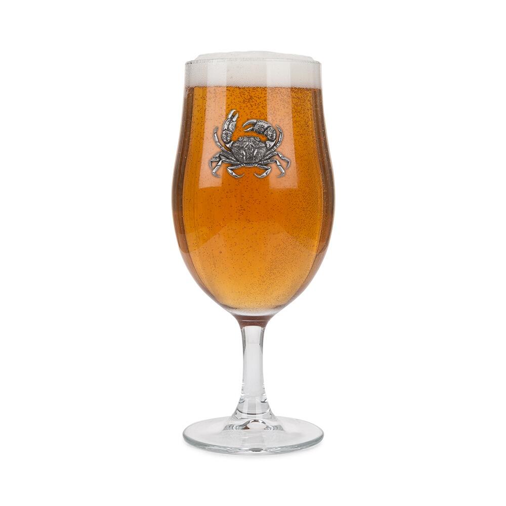 A Stemmed Pint Beer Glass with a Pewter Crab badge on the front, filled with BeerRetryClaude can make mistakes. Please double-check responses.