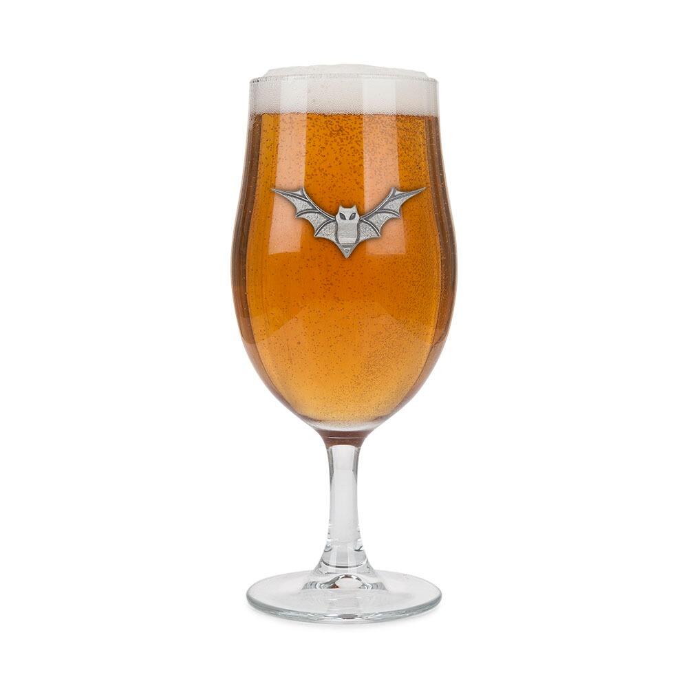 A Stemmed Pint Beer Glass with a Pewter Bat badge on the front, filled with Beer