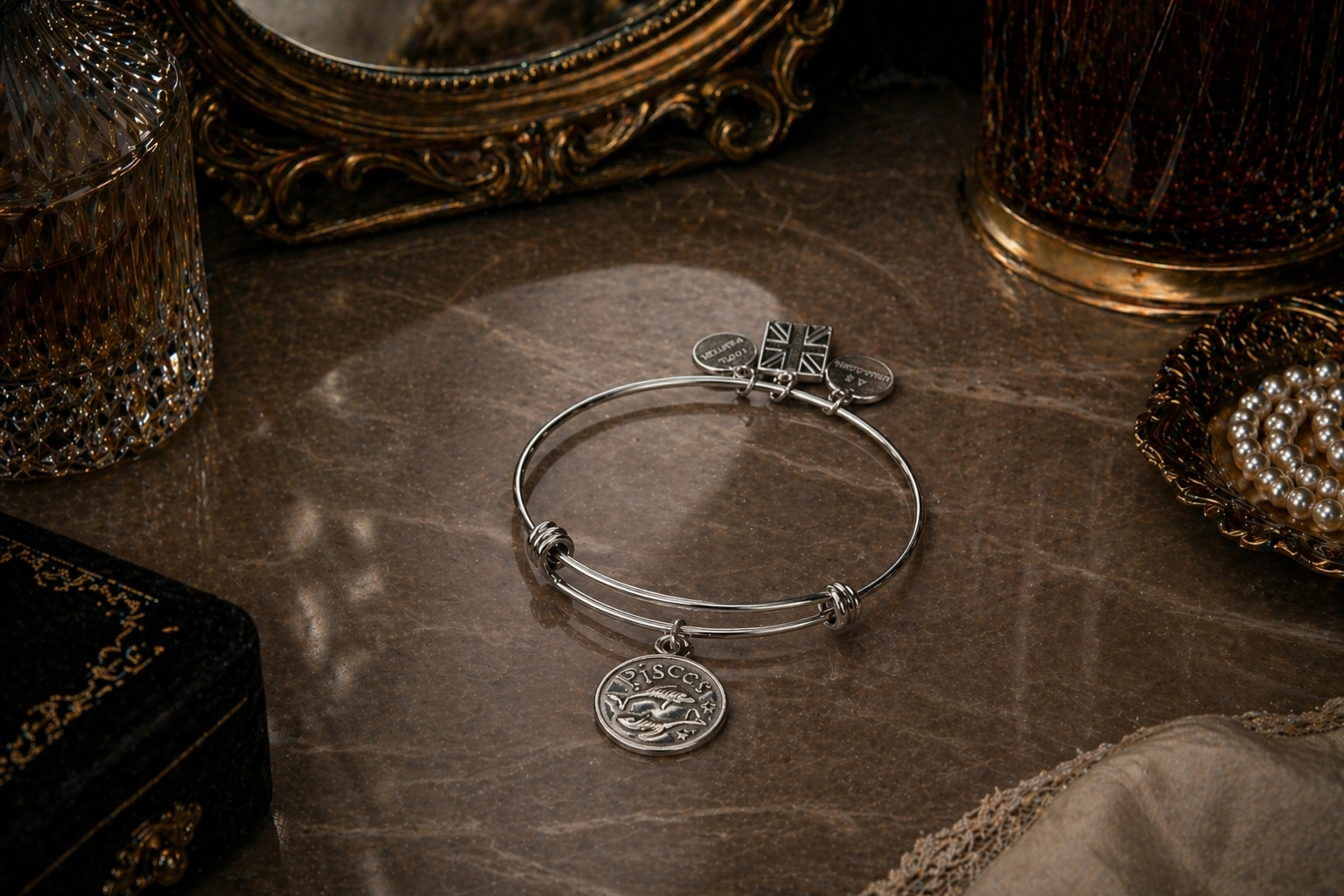 Pisces charm in pewter on a bracelet on a vanity bench