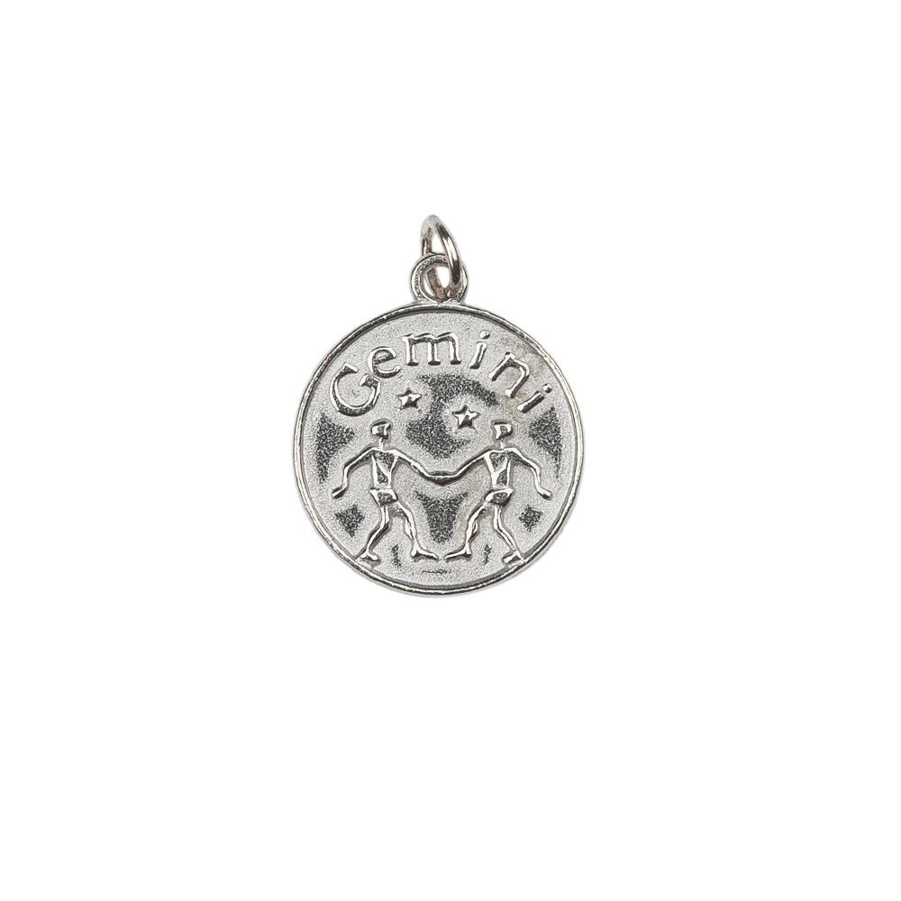 A pewter Gemini Charm