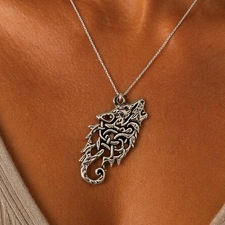 Detailed pewter Celtic wolf pendant featuring an intricate howling wolf head profile composed of tight knotwork