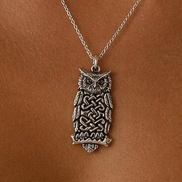 Detailed pewter Celtic owl pendant featuring intricate knotwork on the body while perched on a branch