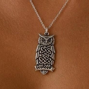Detailed pewter Celtic owl pendant featuring intricate knotwork on the body while perched on a branch