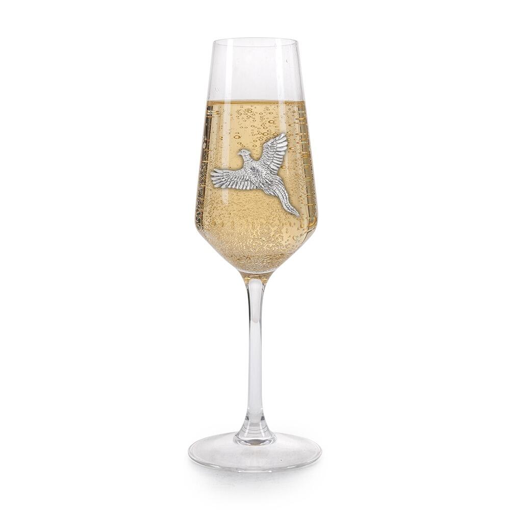 A Champagne Flute with a Pewter Pheasant badge on the front, filled with Champagne