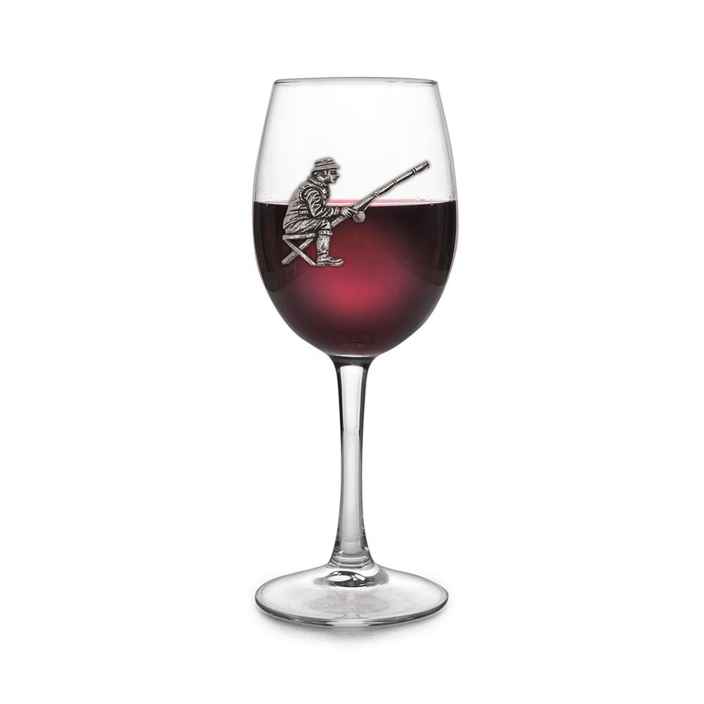 Wine glass with handmade pewter fishing man badge filled with red wine