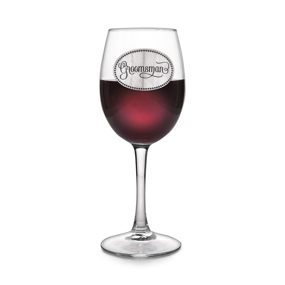 Wine glass with handcrafted pewter Groomsman badge filled with red wine