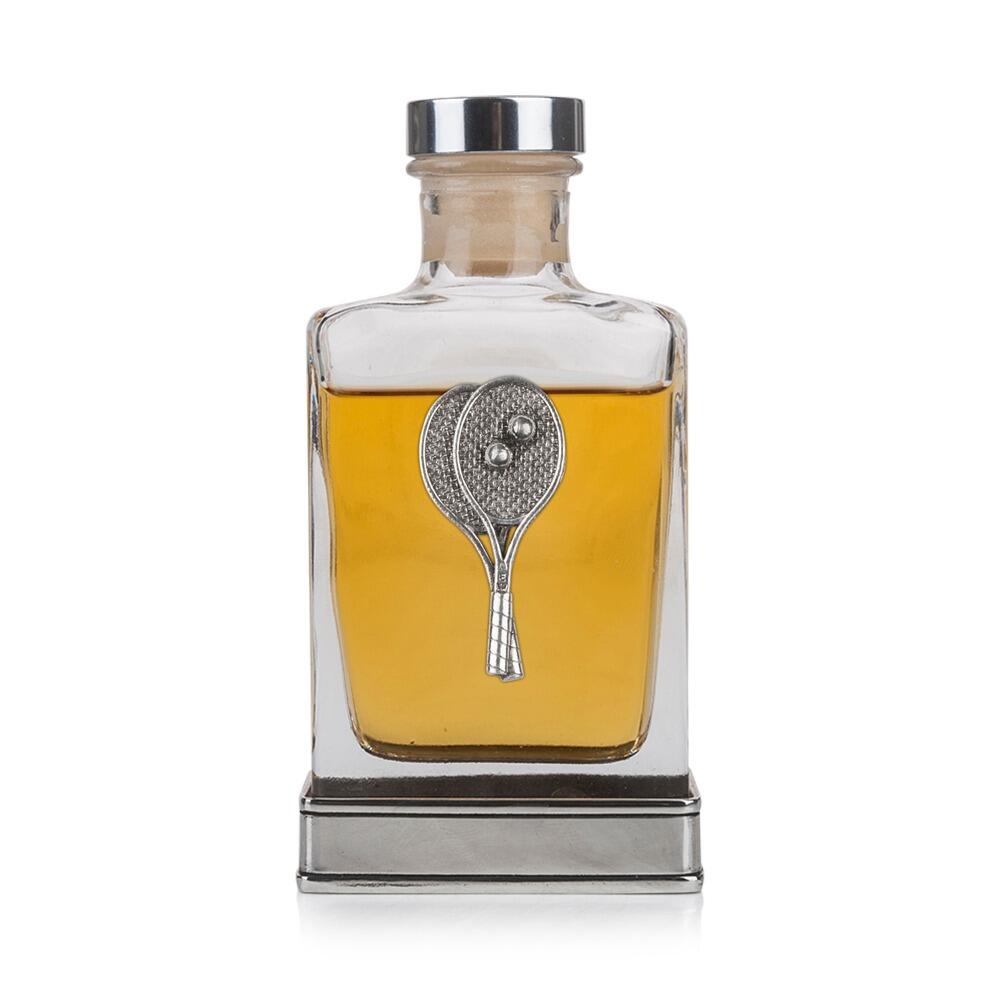 A glass flask with a pewter base and a handcrafted pewter tennis emblem on the front