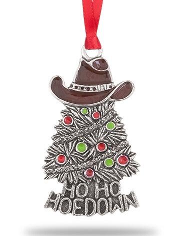 Hand-enamelled pewter Christmas tree bauble with cowboy hat and "Ho Ho Hoedown" text hanging on tree