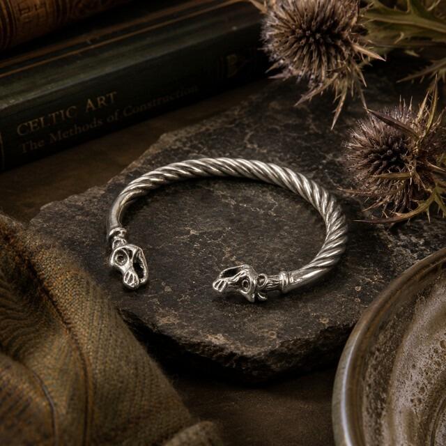 Viking-style twisted pewter torc bangle featuring sculpted dragon head terminals