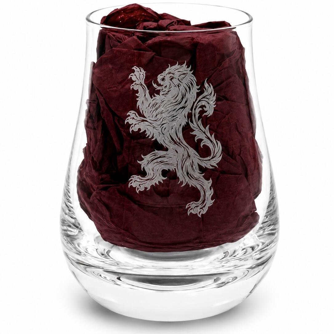 Close-up of Rampant Lion engraved whisky tasting glass with burgundy gift-box tissue