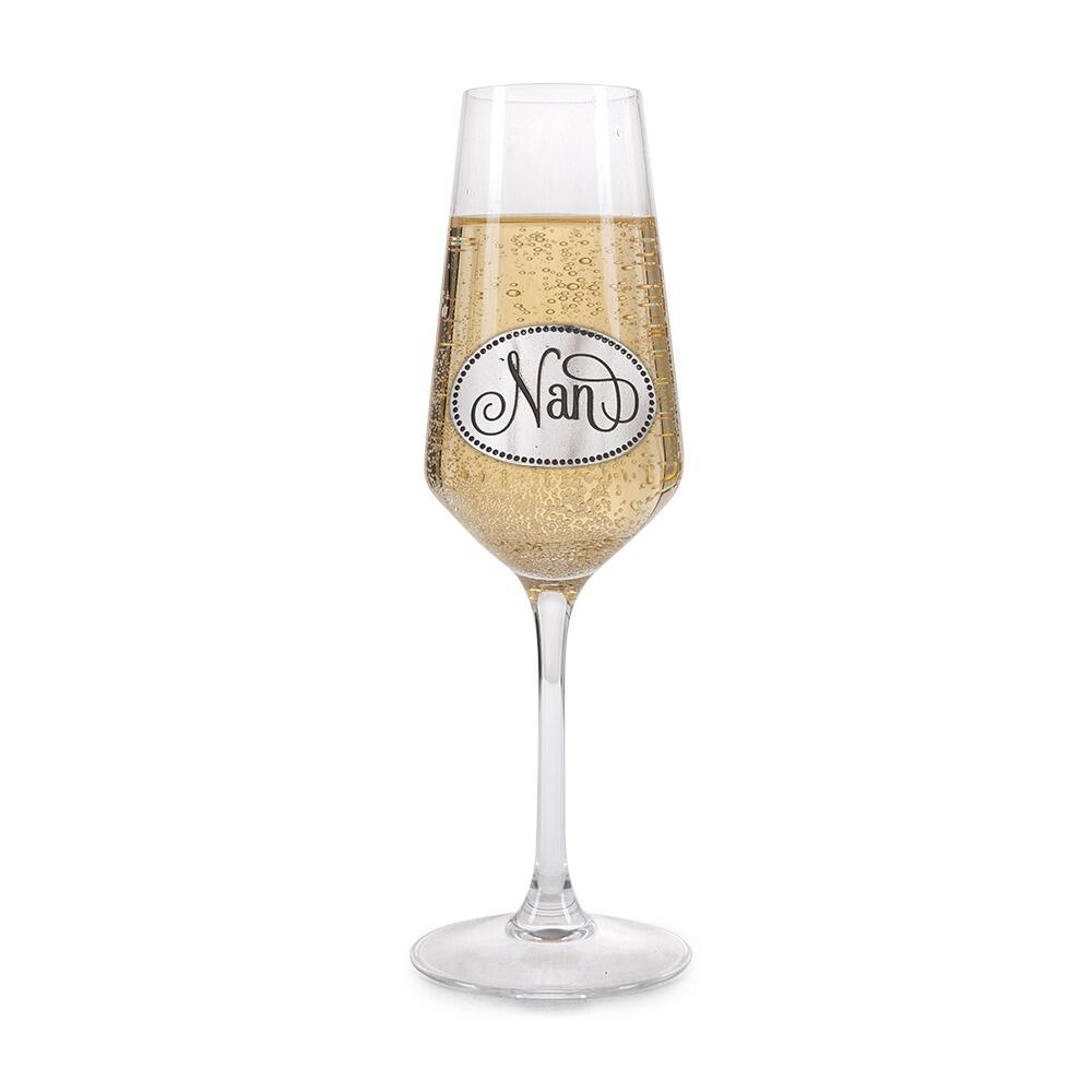 A Champagne Flute with a Pewter Nan badge on the front, filled with Champagne