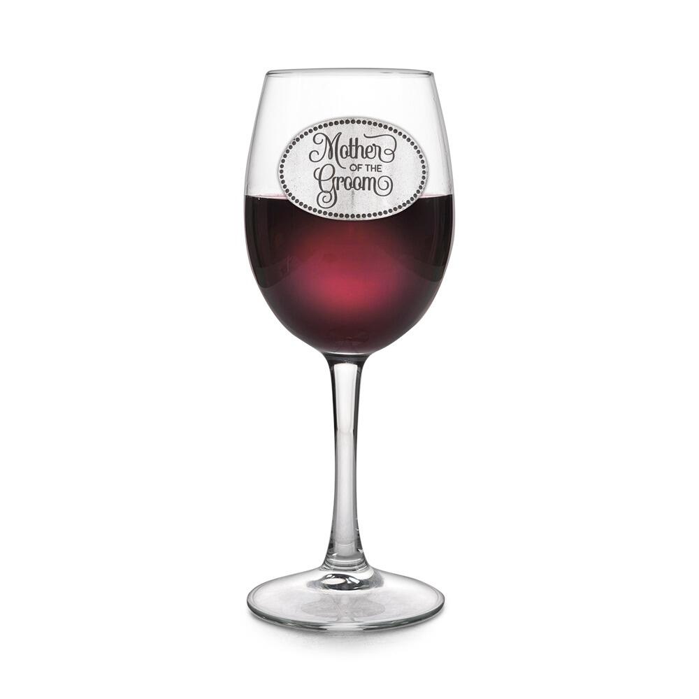 Wine glass with handmade pewter Mother Of The Groom badge filled with red wine