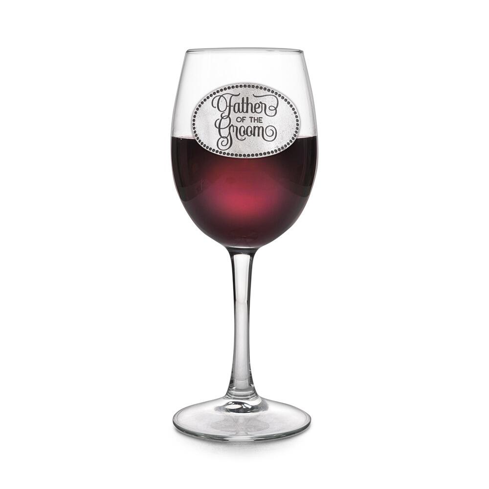 Wine glass with handcrafted pewter Father of the Groom badge filled with red wine