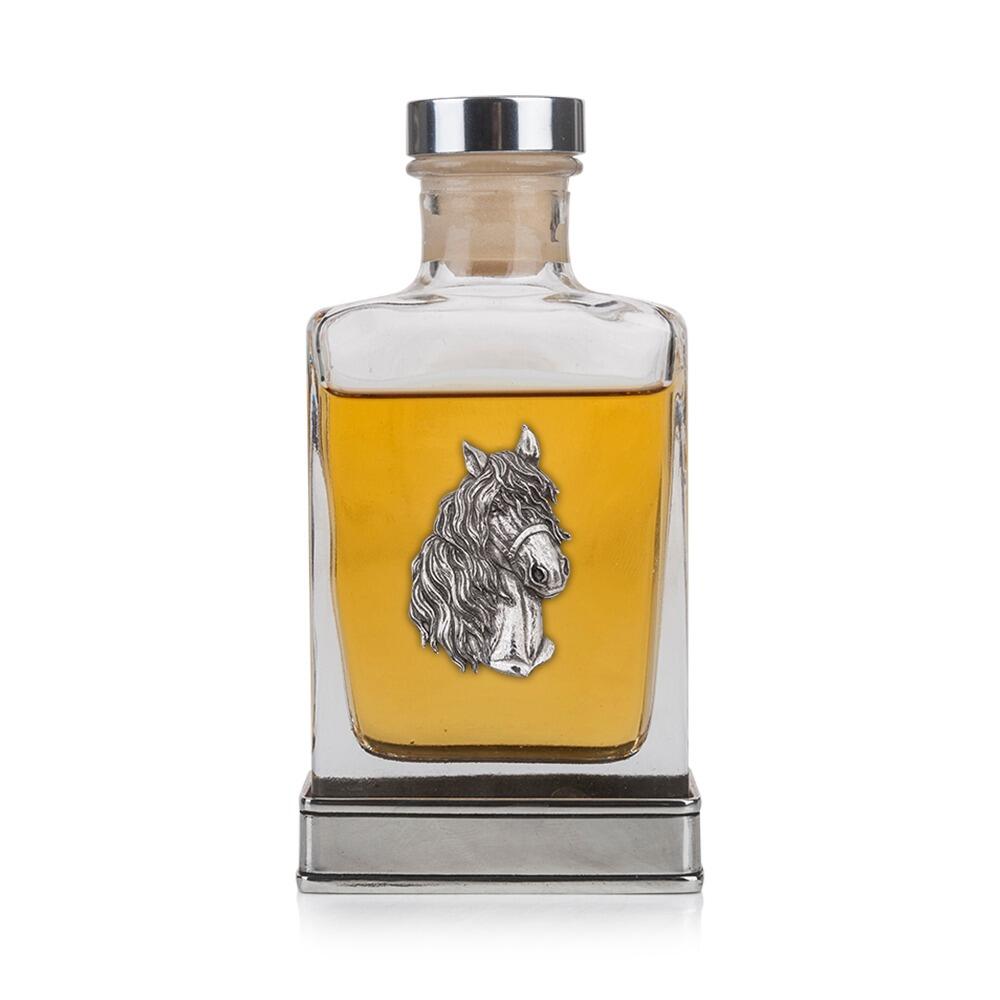 A glass flask with a pewter base and a handcrafted pewter horse emblem on the front