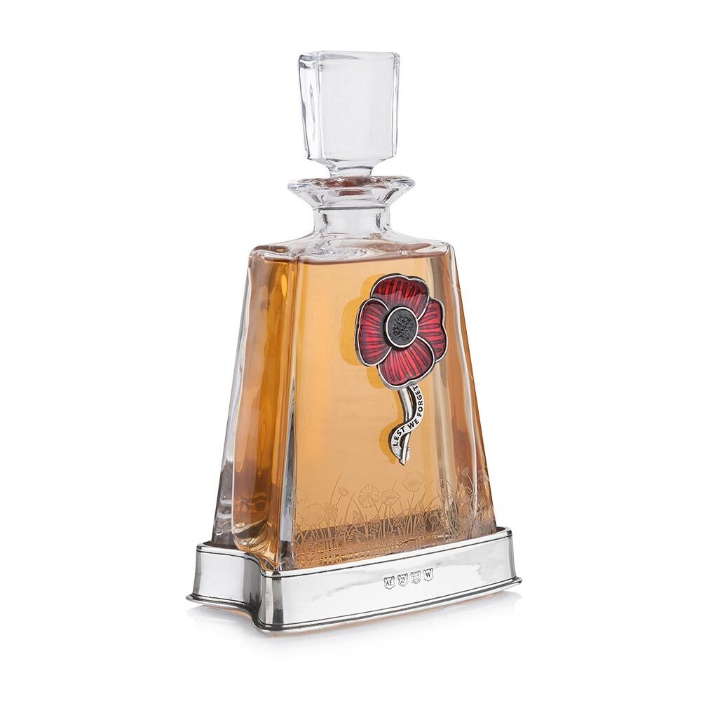 Crystal decanter with hand-enamelled red pewter poppy badge and polished pewter base filled with amber spirit