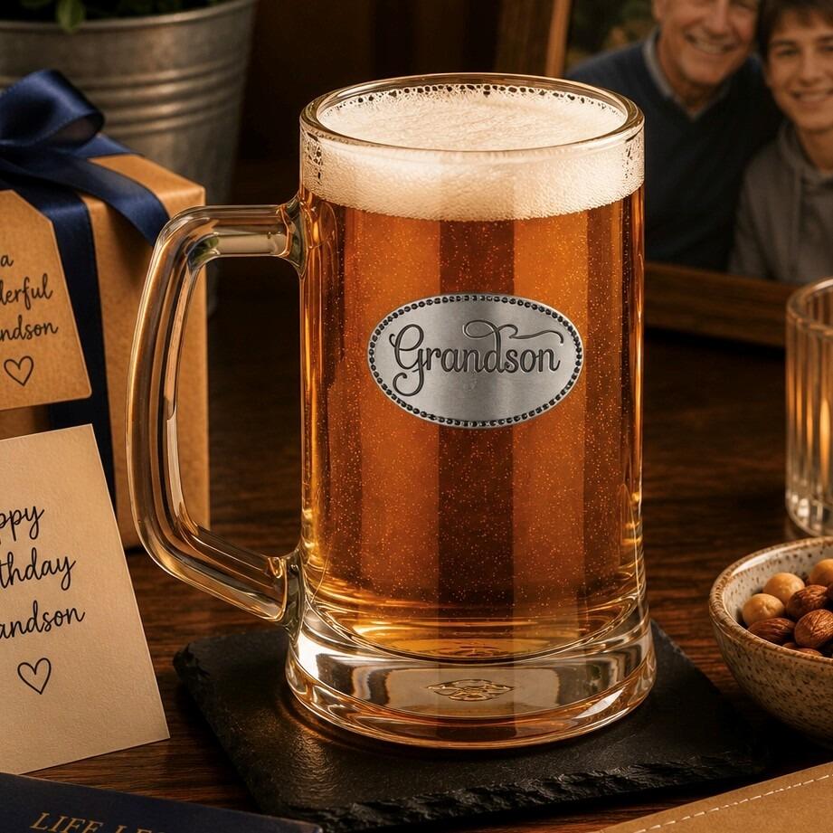 A Beer Tankard with a Pewter Grandson badge on the front, filled with Amber Beer