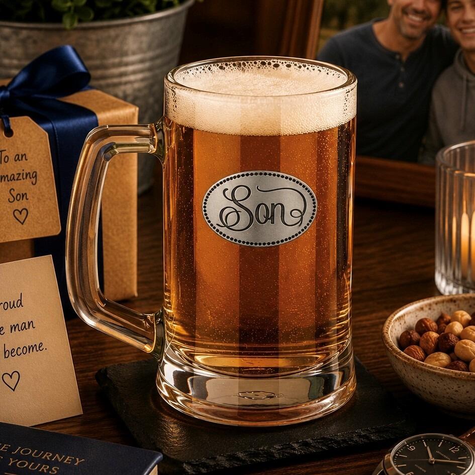 A Beer Tankard with a Pewter Son badge on the front, filled with Amber Beer
