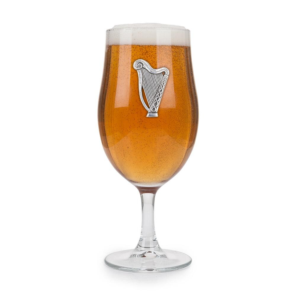 A Stemmed Pint Beer Glass with a Pewter Harp badge on the front, filled with Beer