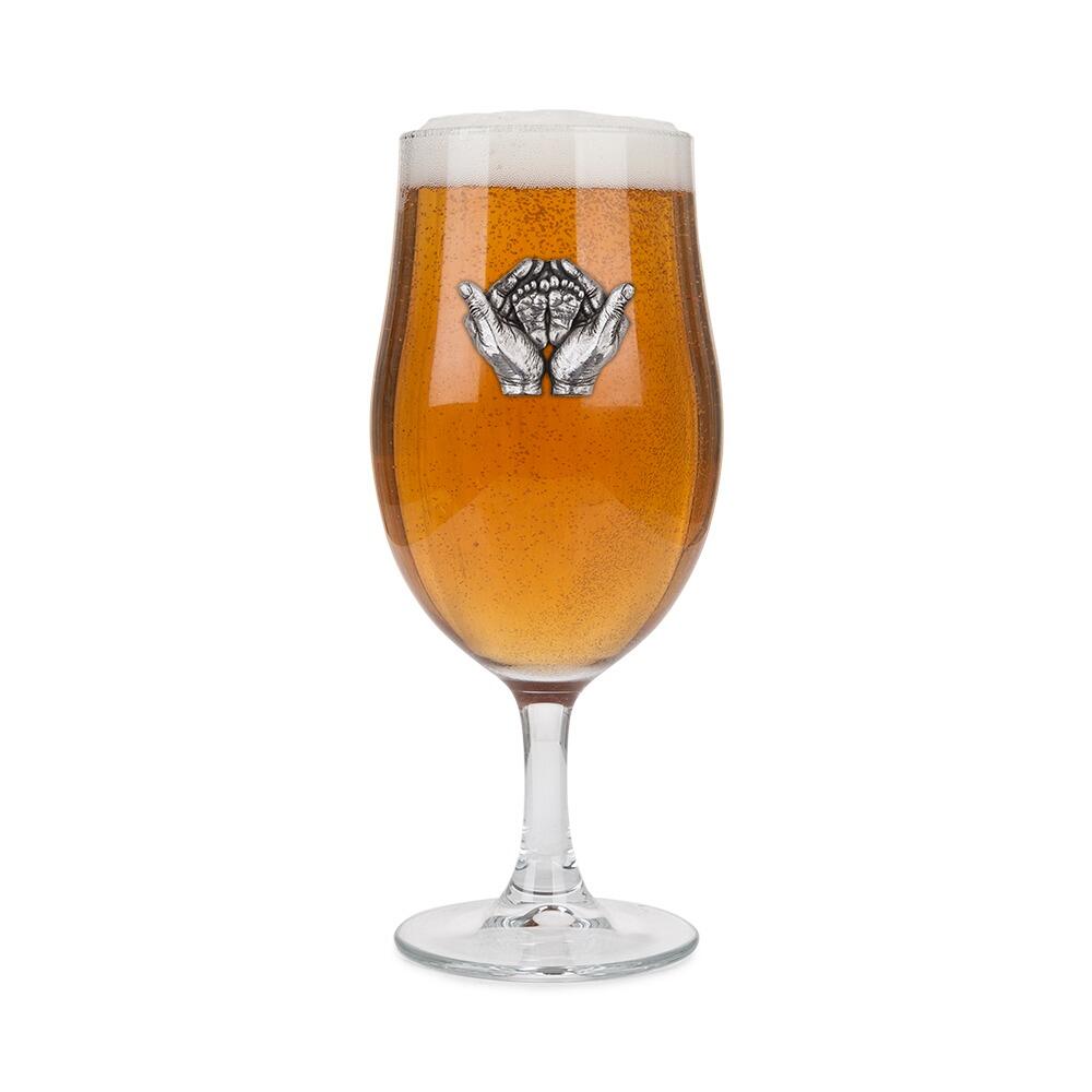 A Stemmed Pint Beer Glass with a Pewter Baby Feet badge on the front, filled with Beer