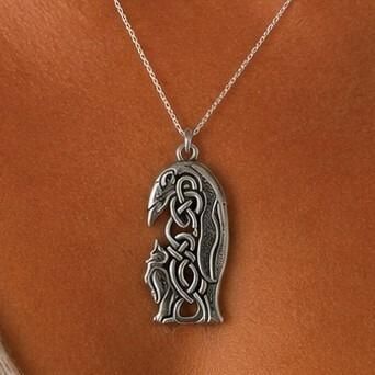 Detailed pewter Celtic penguin pendant featuring intricate interlace knotwork forming the body and wing