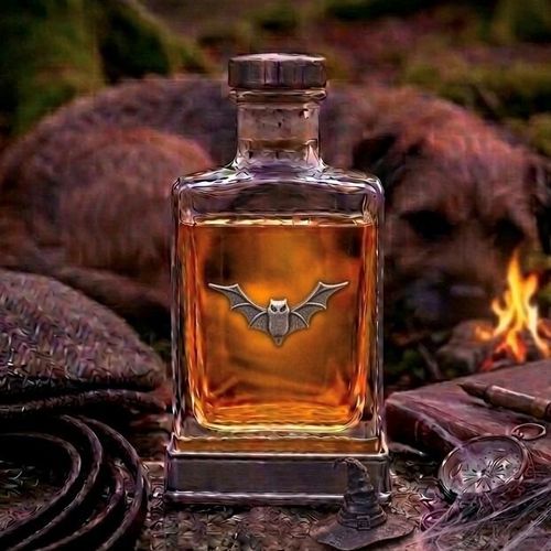 Handcrafted glass hip flask with pewter base featuring detailed bat emblem on front