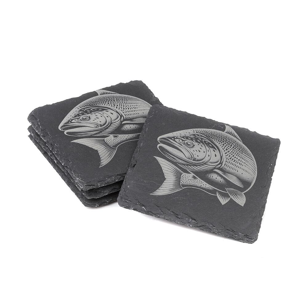 Two stacks of square slate coasters, each engraved with a detailed Salmon design.