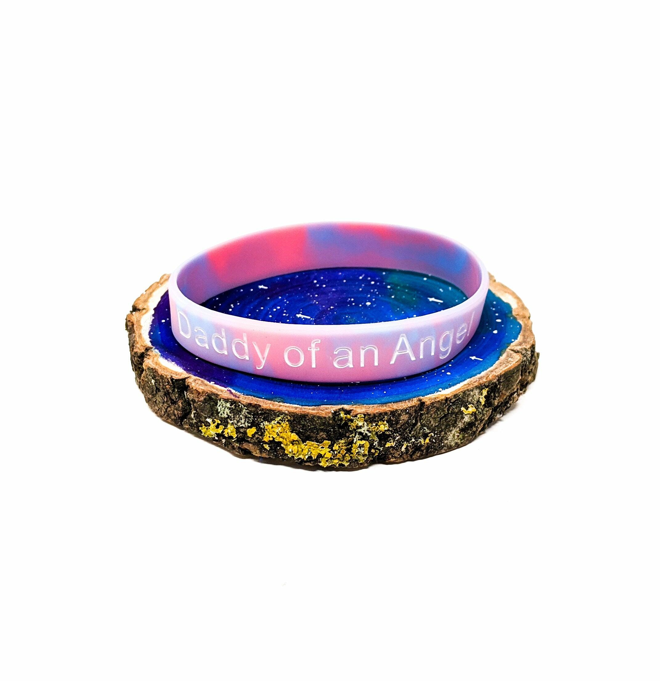 Baby loss awareness bracelet with “Daddy of an Angel” message on pink and blue silicone band