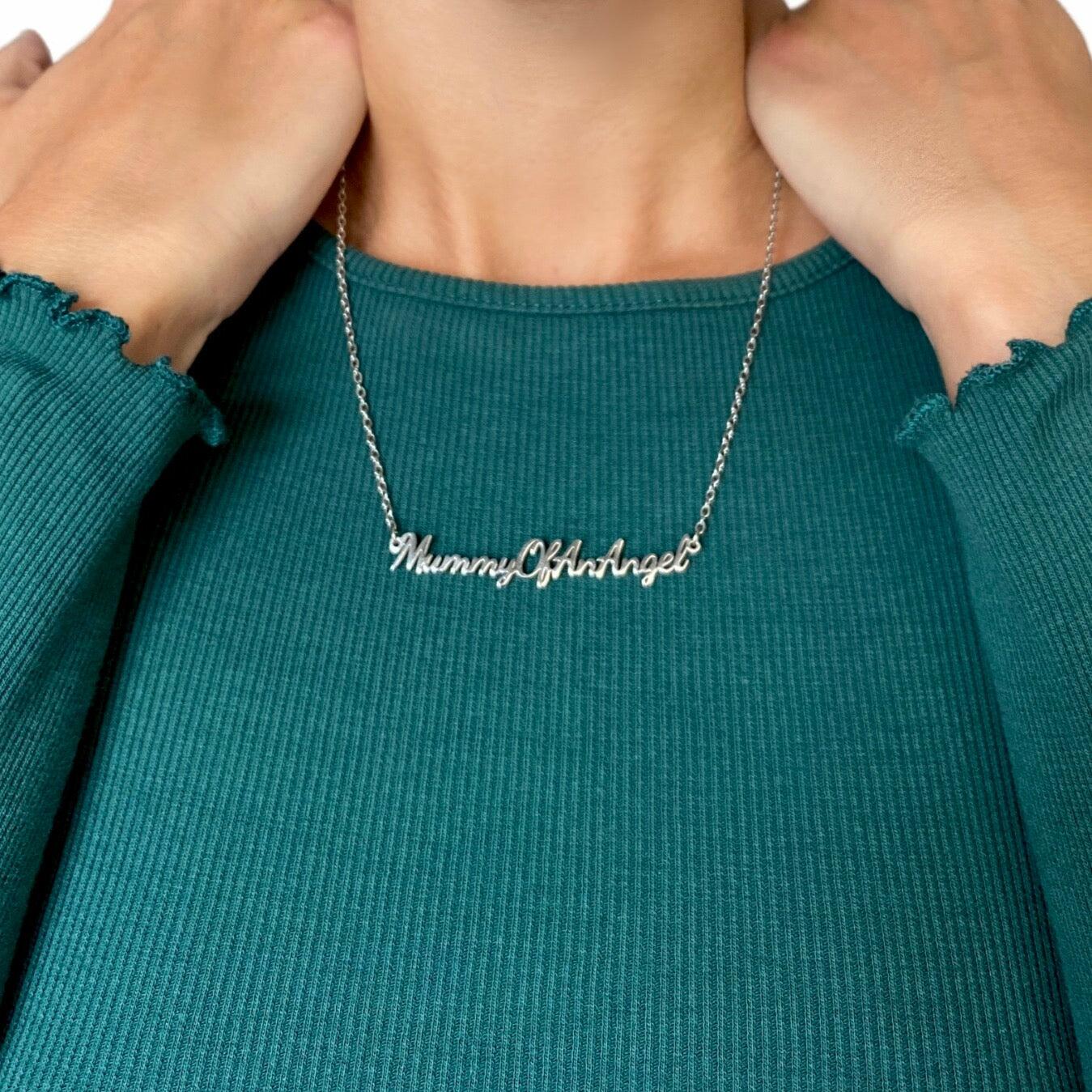 Person wearing Mummy of an Angel necklace showing how the ‘Mummy of an Angel’ pendant sits on the chest