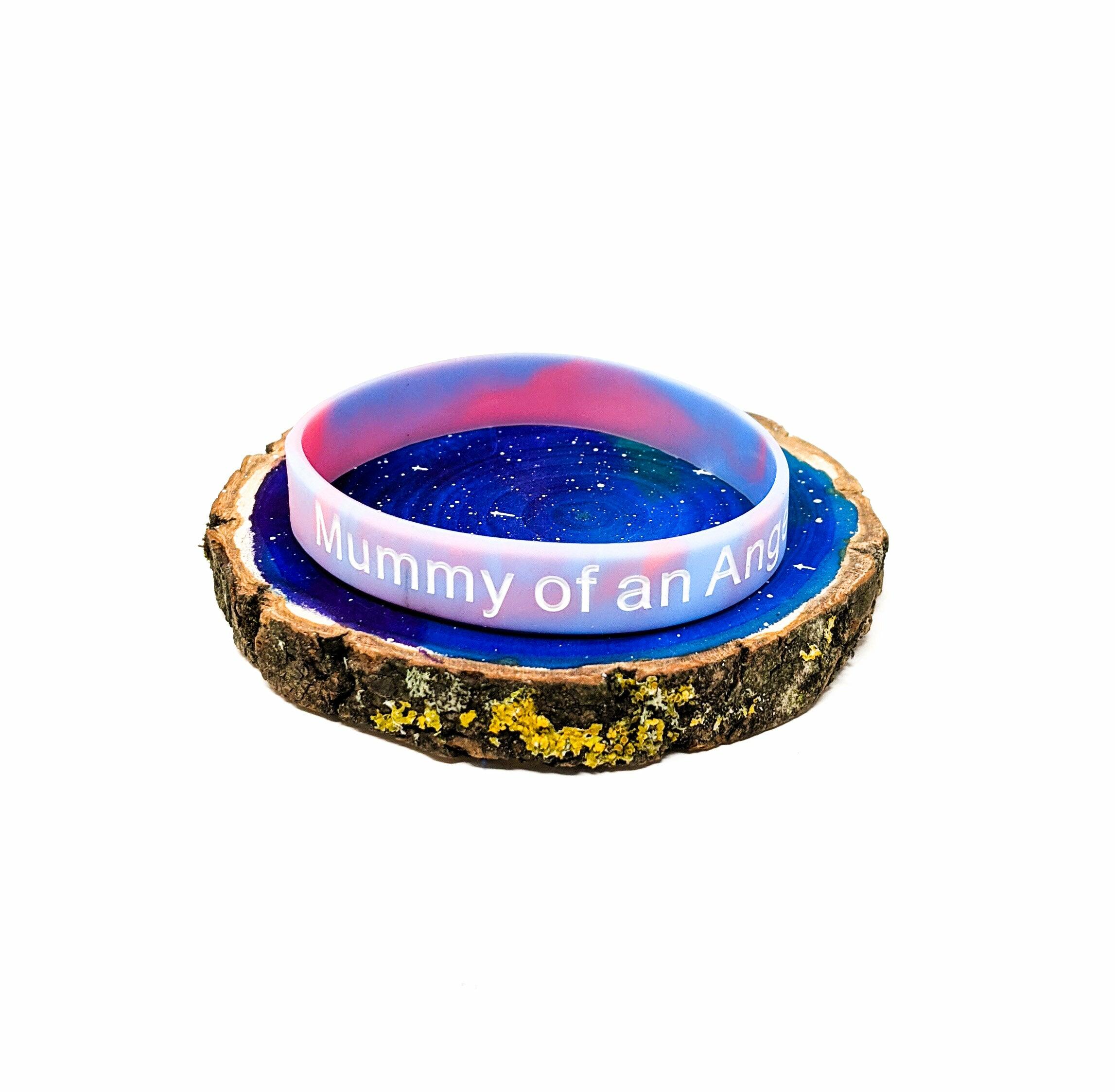 Baby loss awareness bracelet with “Grandma of an Angel” text on marble coloured silicone wristband