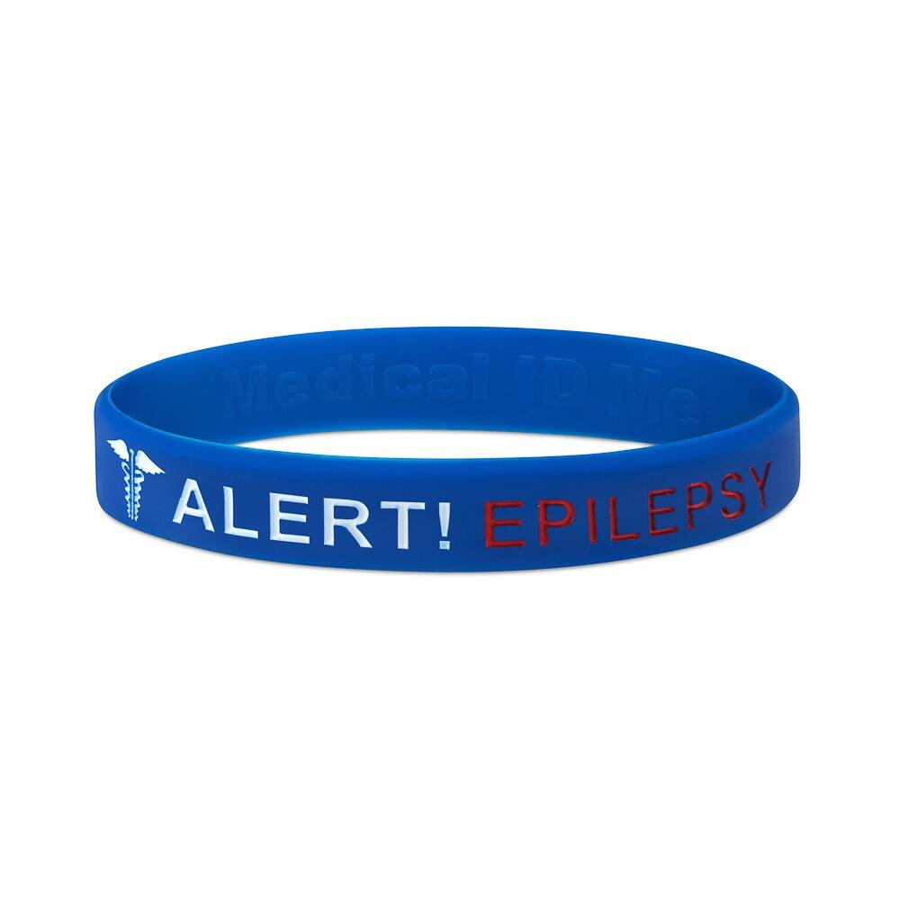 Blue Alert Epilepsy silicone medical alert bracelet on stone display stand