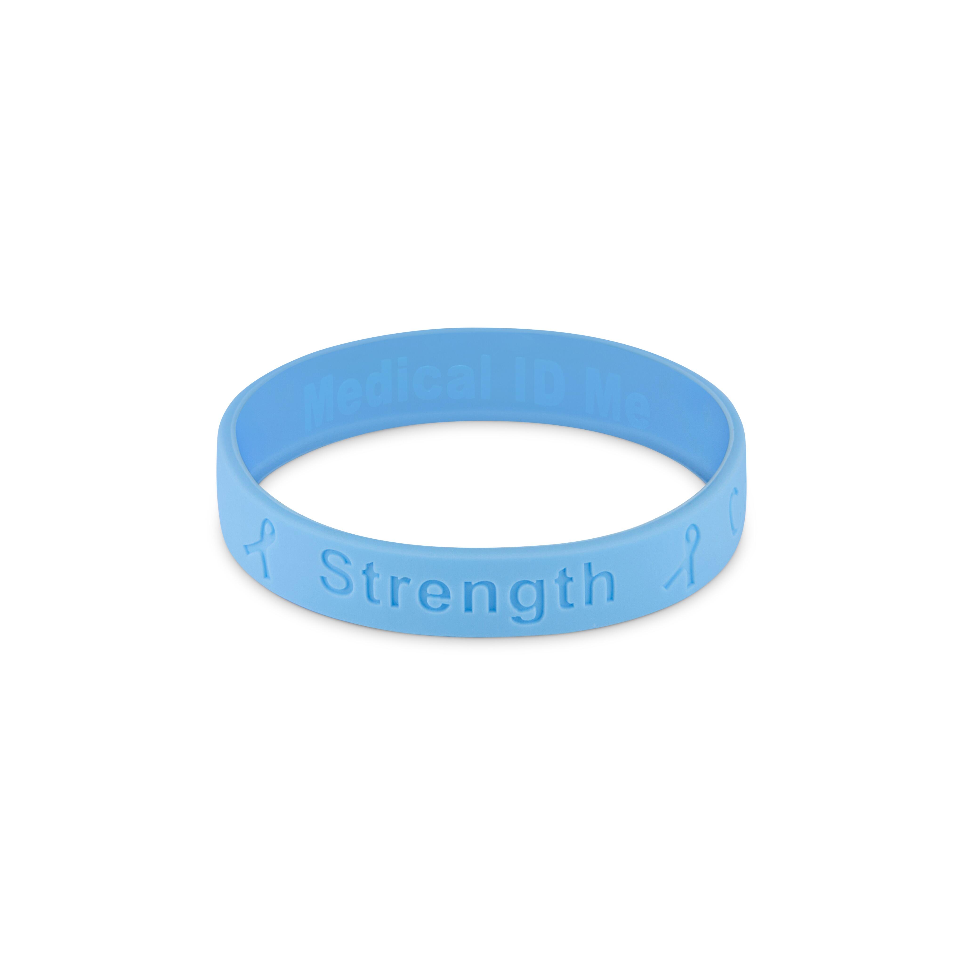 Blue silicone cancer awareness bracelet showing the word “Strength”.