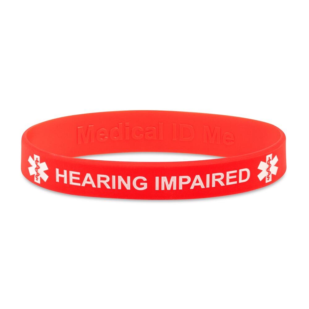 Red silicone bracelet with debossed white text 'HEARING IMPAIRED' and medical alert symbols